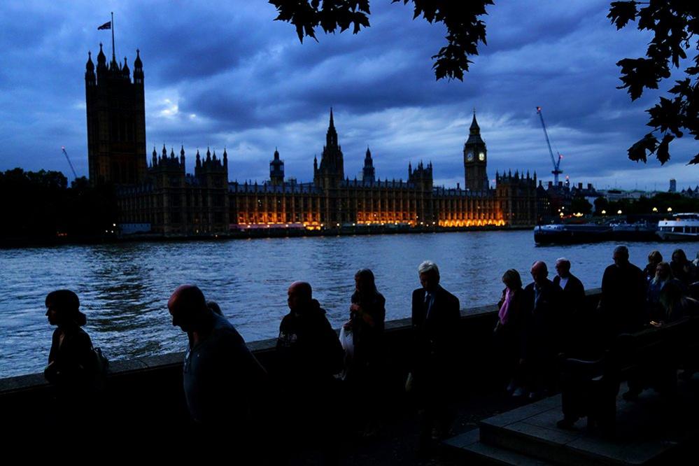 Members of the public stand in the queue on the South Bank