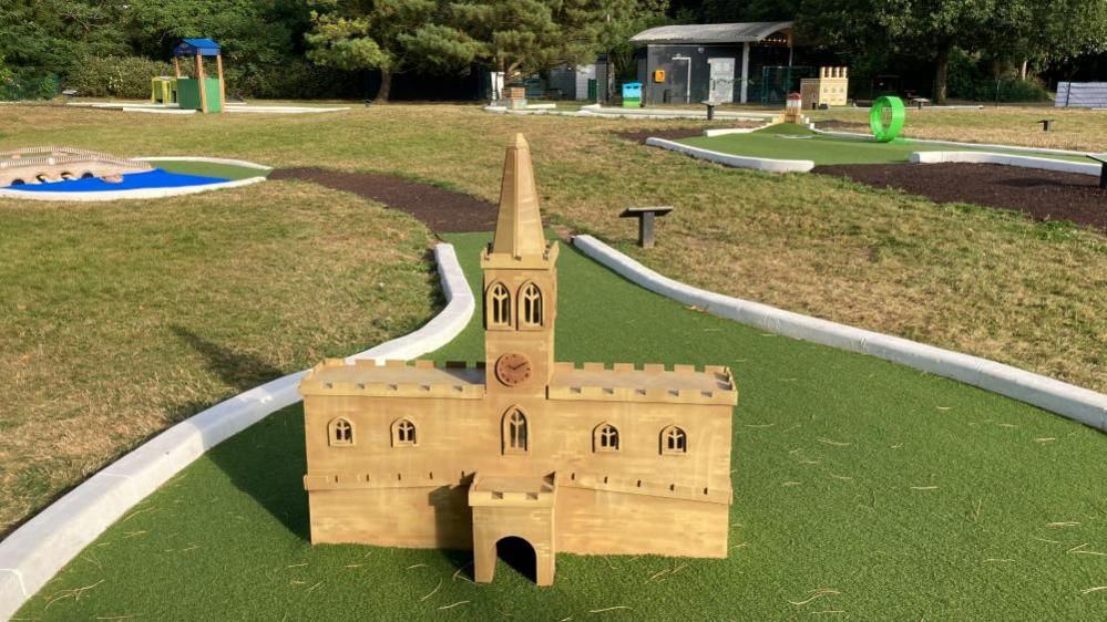 A wooden replica of St Paul's Church, Bedford, on a crazy golf course