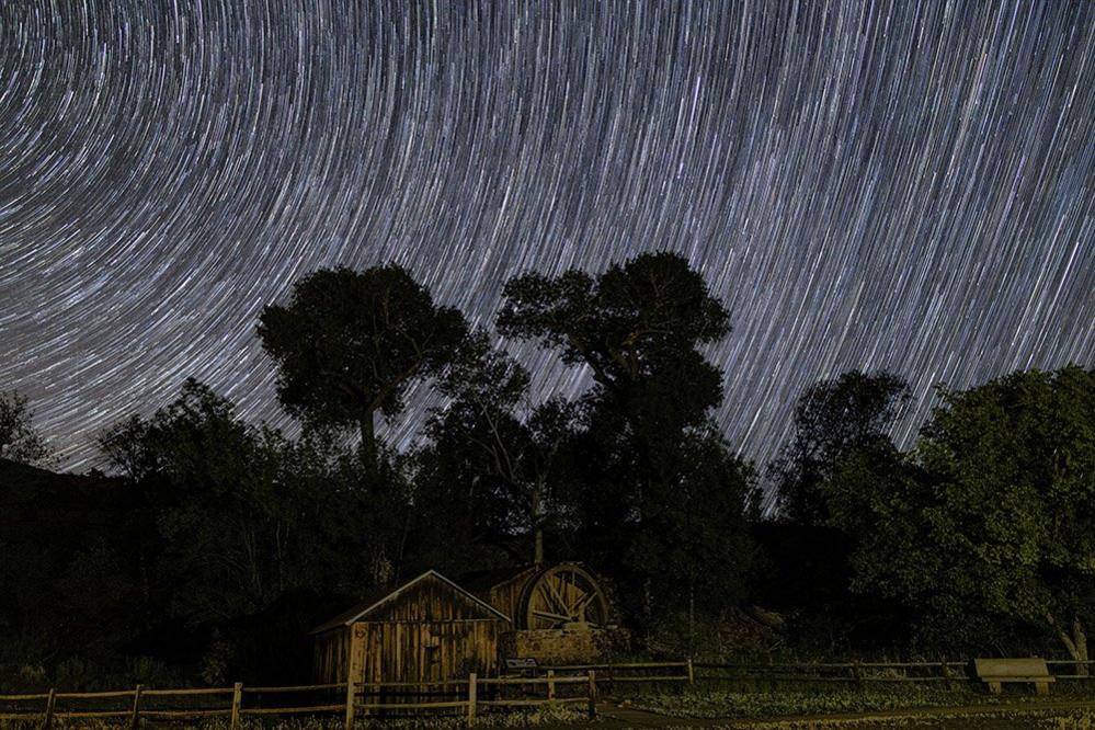 Waterwheel under the night sky