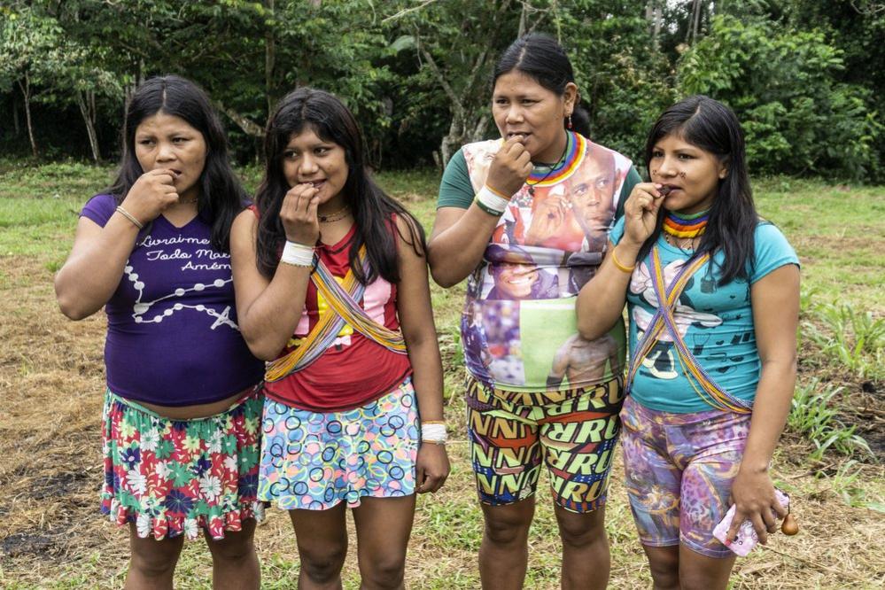 Four women try the chocolate