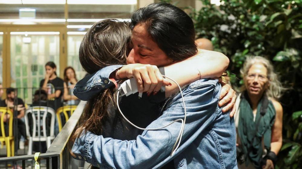 Einav Zangauker, the mother of hostage Matan Zangauker, reacts after Trump's announcement