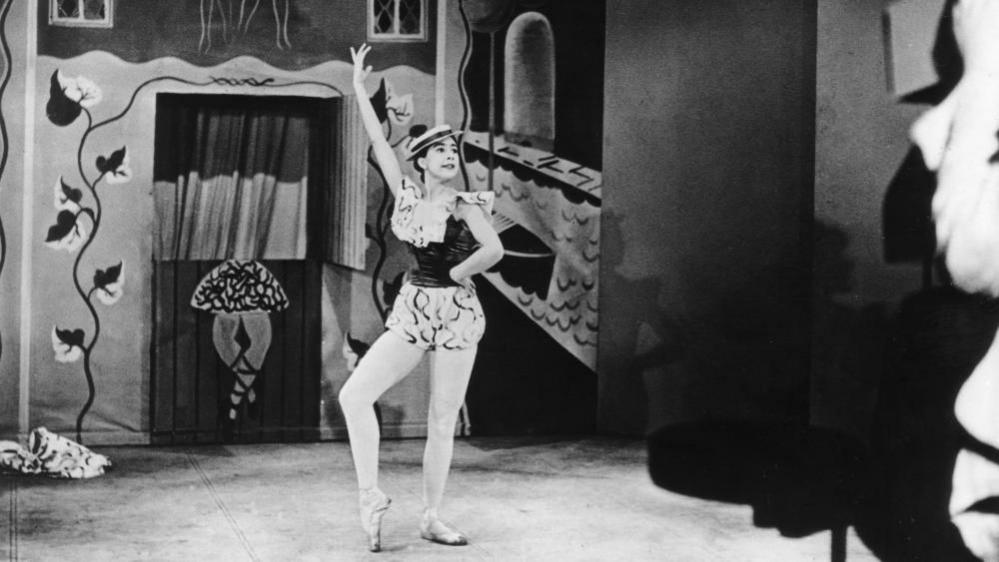 A black and white photo of Dame Margot Fonteyn dancing 