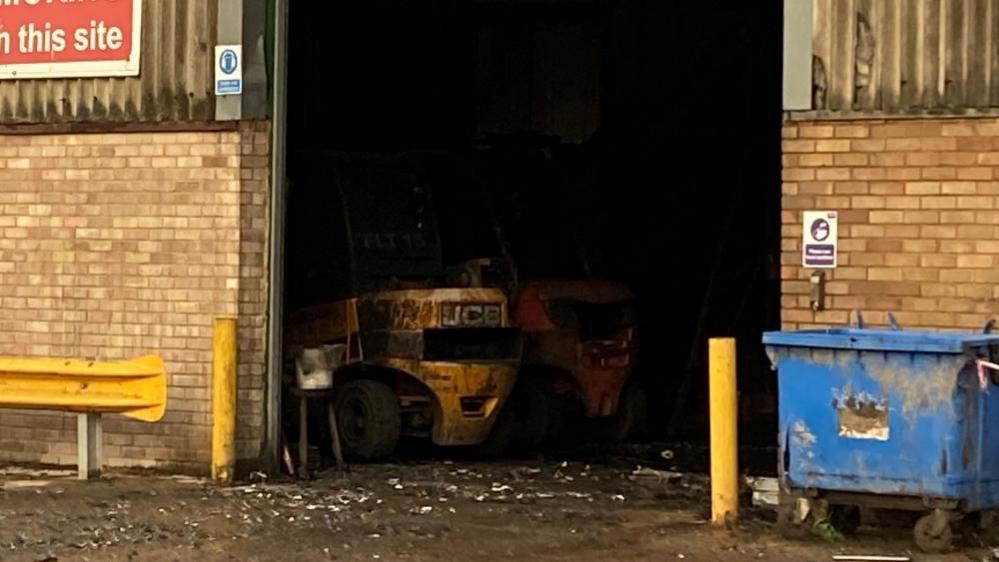 A paper recycling warehouse showing fire damage