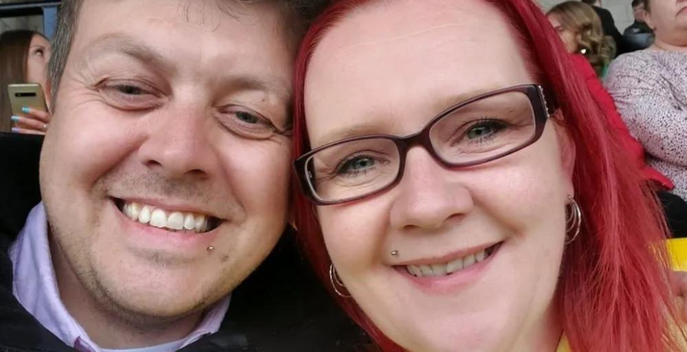 Duane and Nikki Barrett looking at the camera and smiling. The picture shows the head and shoulders of both people. 