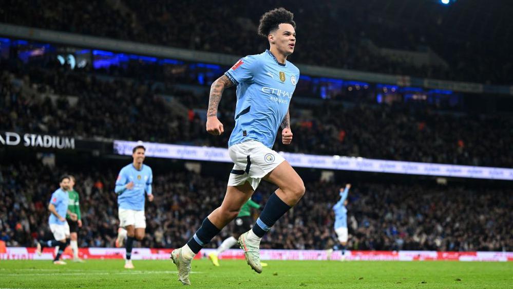 Nico O'Reilly celebrates scoring a goal for Manchester City against Plymouth Argyle