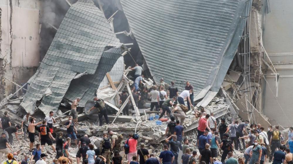 Rescue workers at a damaged hospital