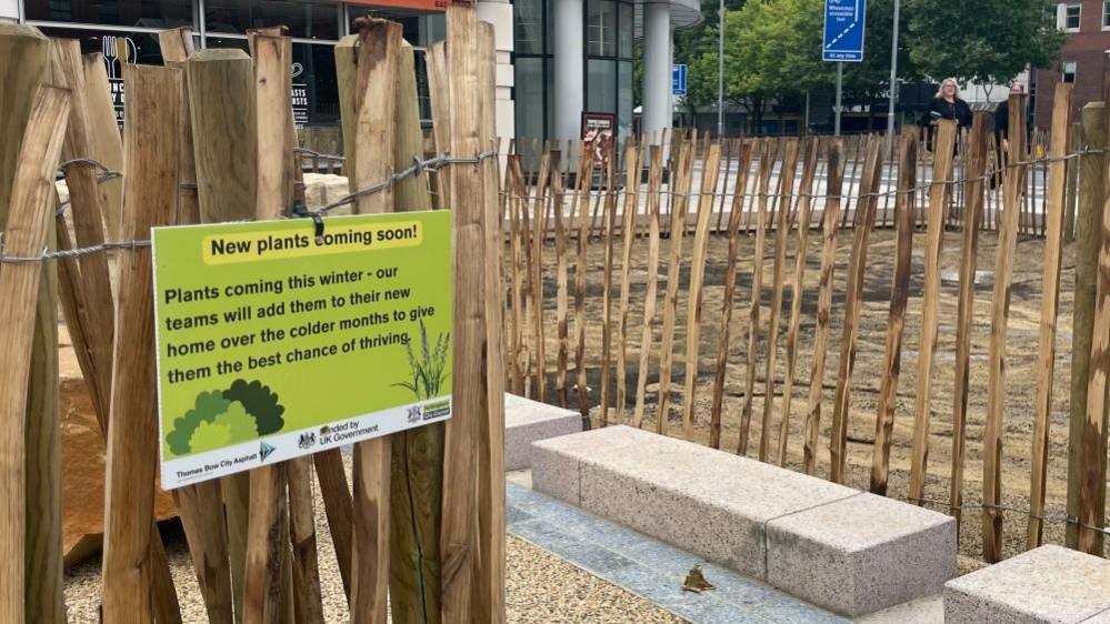 A view of empty planters at the new T-junction, which will have trees and wildflowers added later in the year.