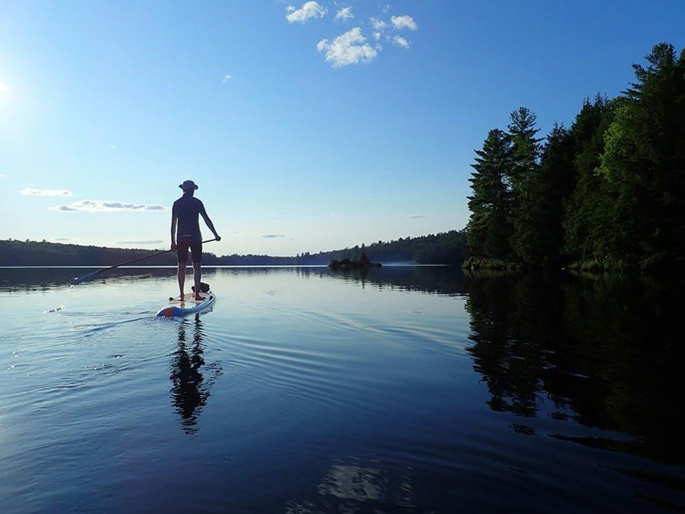 Paddle boarder on a lake