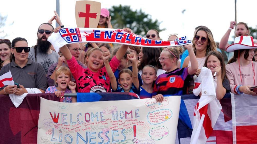 England fans waiting outside London Southend Airport for the England team to arrive on 28 July 2025