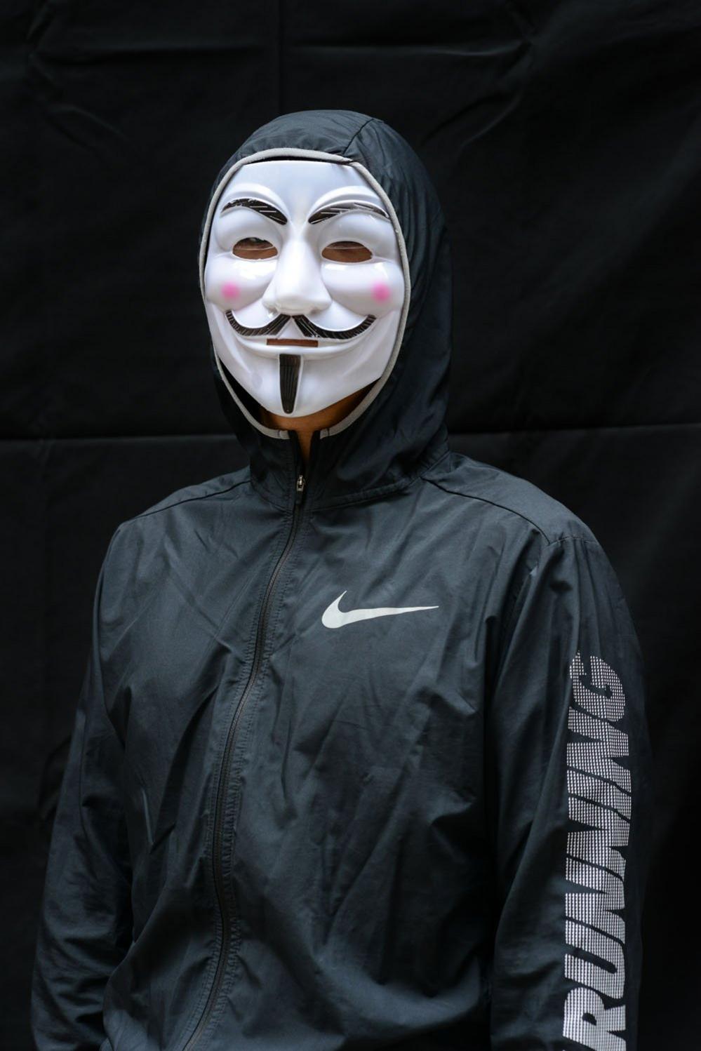 A protester poses for a portrait during the Anti-Totalitarianism march in Causeway Bay, Hong Kong, 29 September 2019