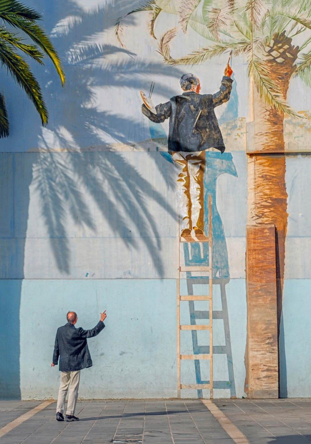 MAn looking at mural