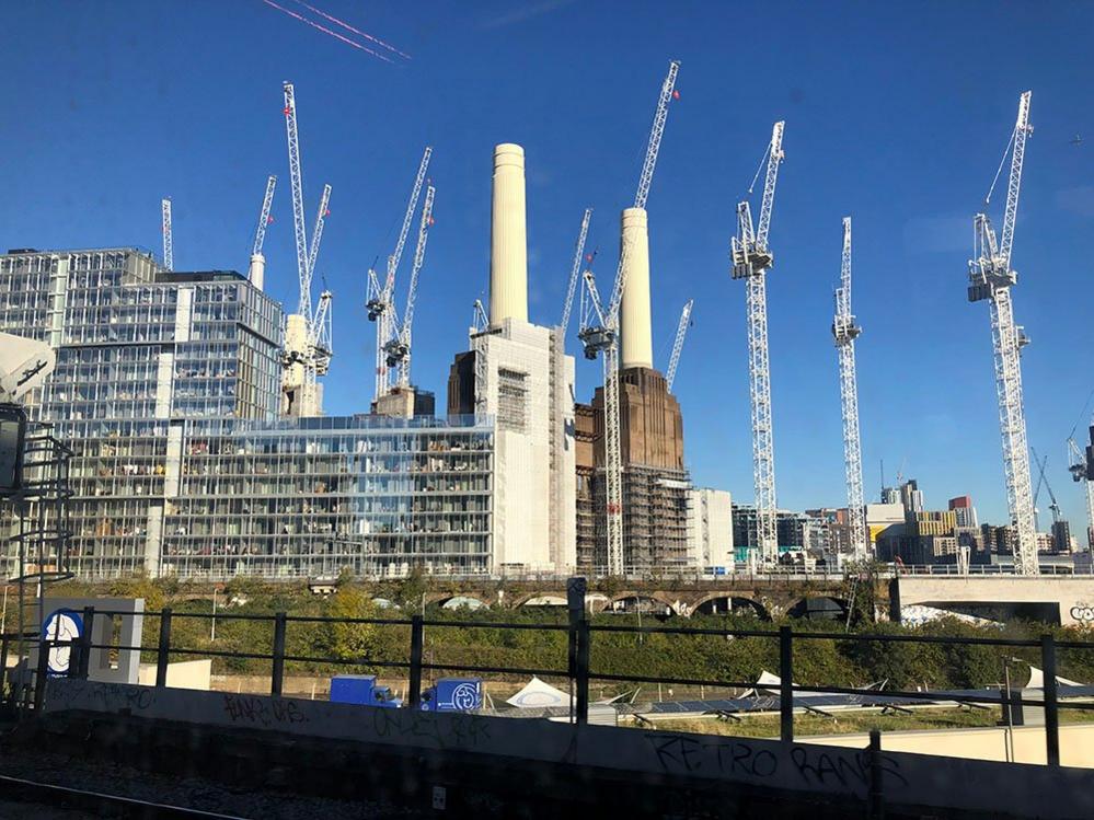 Battersea surrounded by cranes