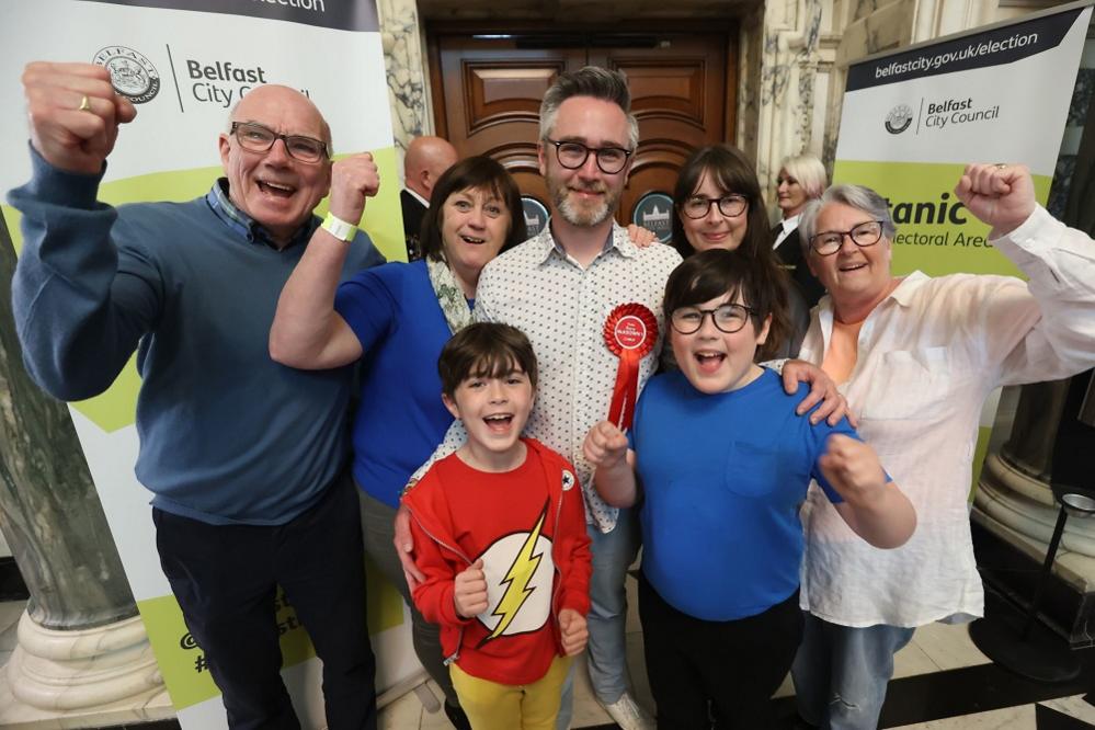 Gary McKeown (centre) from the SDLP at Belfast City Hall during in the Northern Ireland council elections.