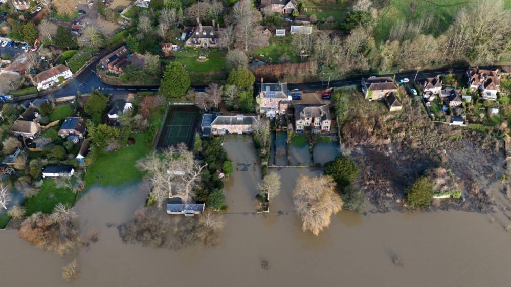 Flood waters reach houses in Pulborough, West Sussex.