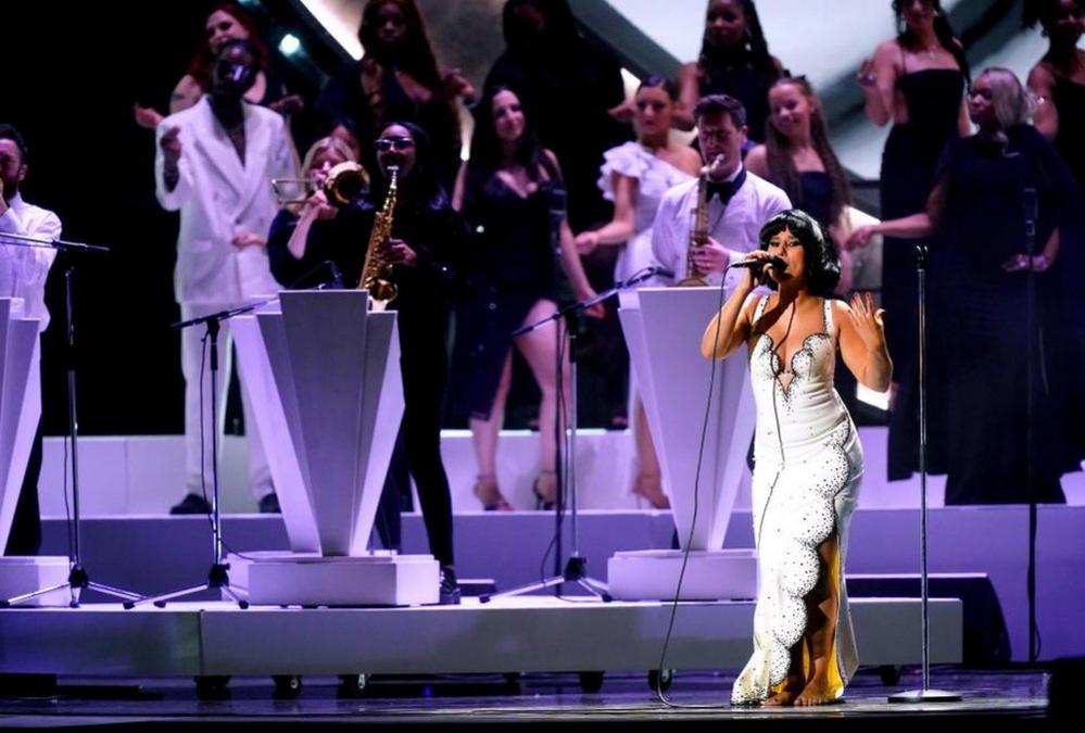 Raye performing on stage during the Brit Awards 2024 at the O2 Arena, London