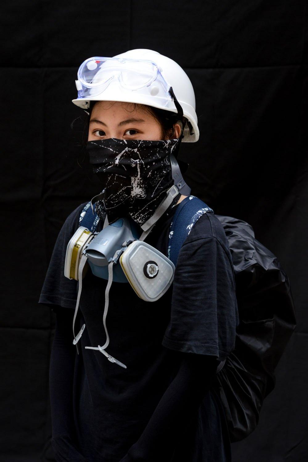 A protester poses for a portrait during the Anti-Totalitarianism march in Causeway Bay, Hong Kong, 29 September 2019