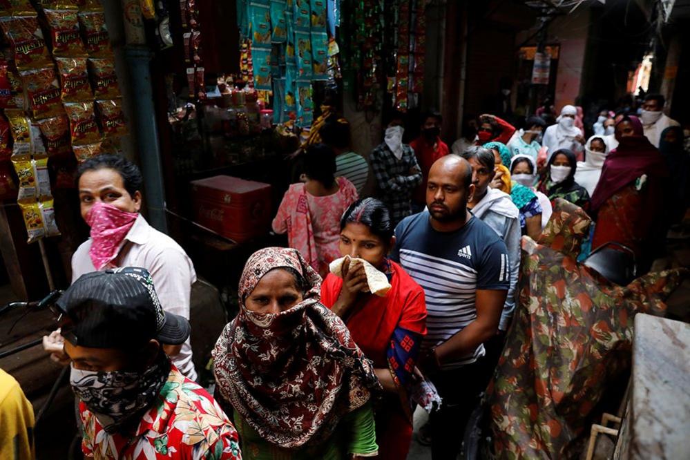 People queue in New Delhi