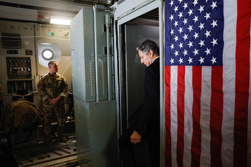 U.S. Secretary of State Antony Blinken boards a plane as he departs for Manama, during his week-long trip aimed at calming tensions across the Middle East, in Tel Aviv, Israel January 10, 2024