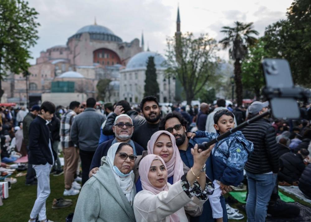 People pose for a selfie