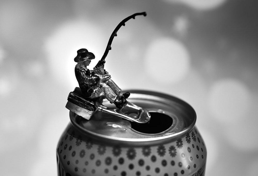 Model of a fisherman on the top of a drink can