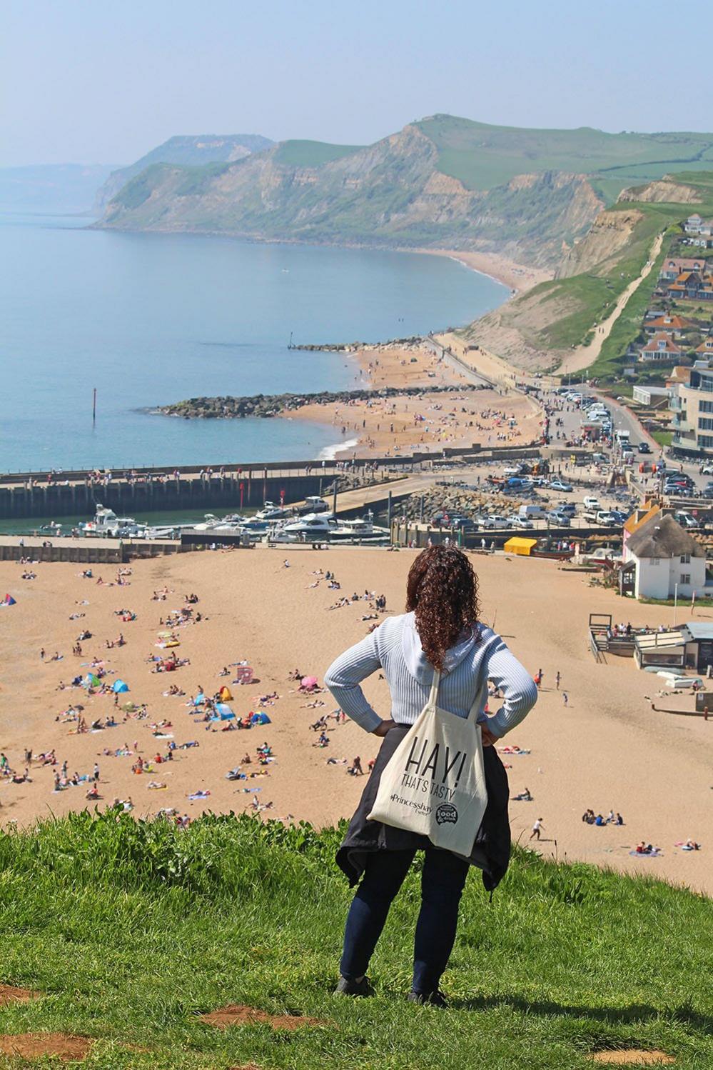 Woman looking down on a beach