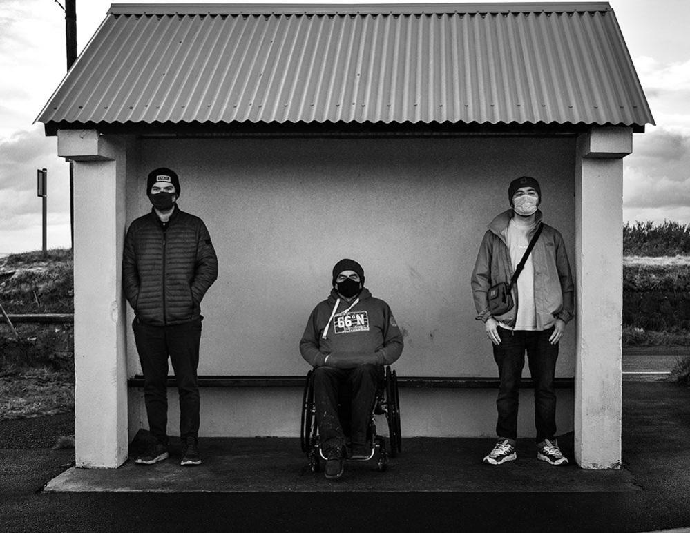 Family at a bus stop