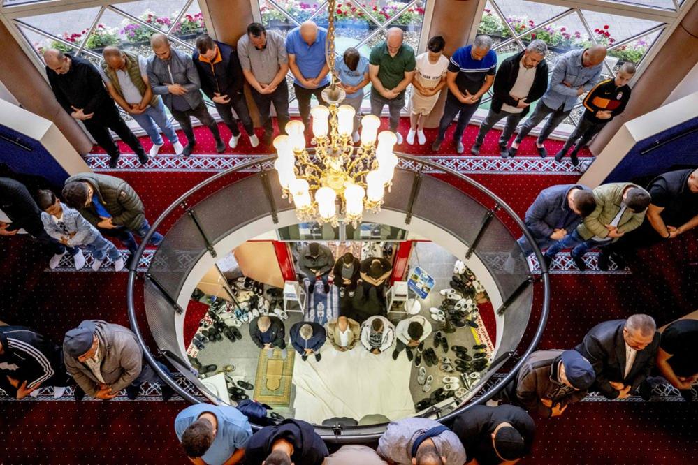 People pray as they attend an early morning prayer on Eid al-Adha, at the Mevlana Mosque in Rotterdam, Netherlands