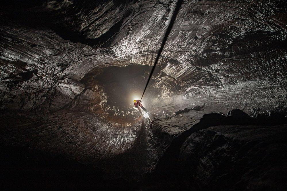 A caver ascending by rope