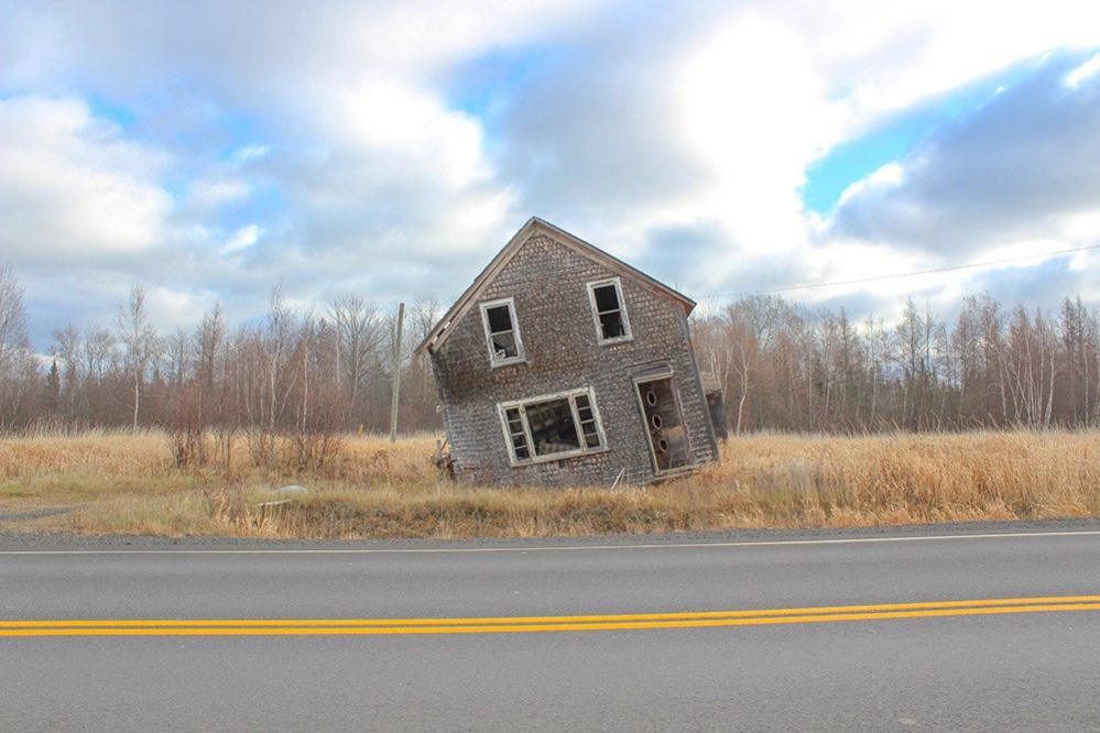 Old home with open door and windows