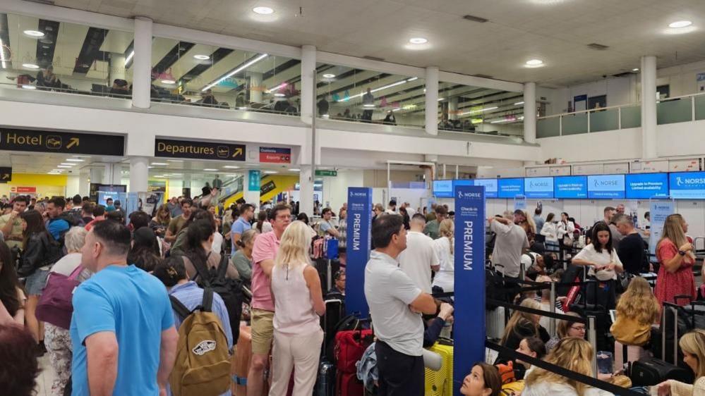 Crowds of people at Gatwick airport