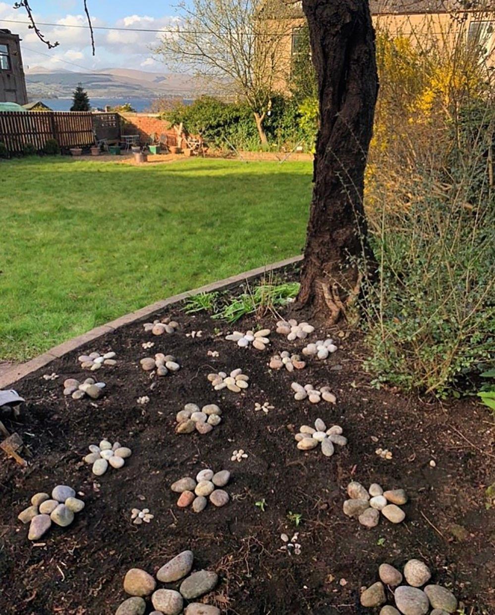 Flower shapes made from pebbles