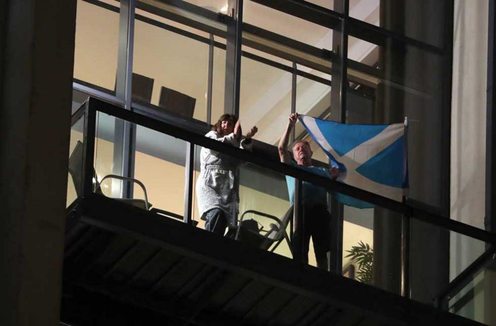 Residents in Glasgow cheer for the NHS