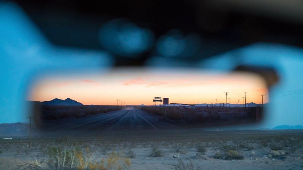 View in a rear view mirror of a car