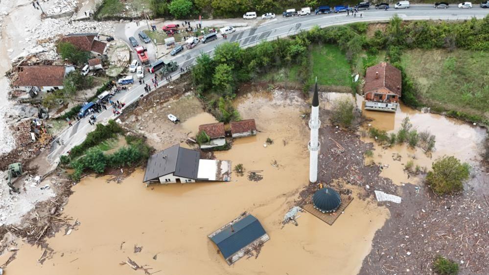 A drone view shows a flooded residential area and mosque in Donja Jablanica, Bosnia and Herzegovina, October 4,