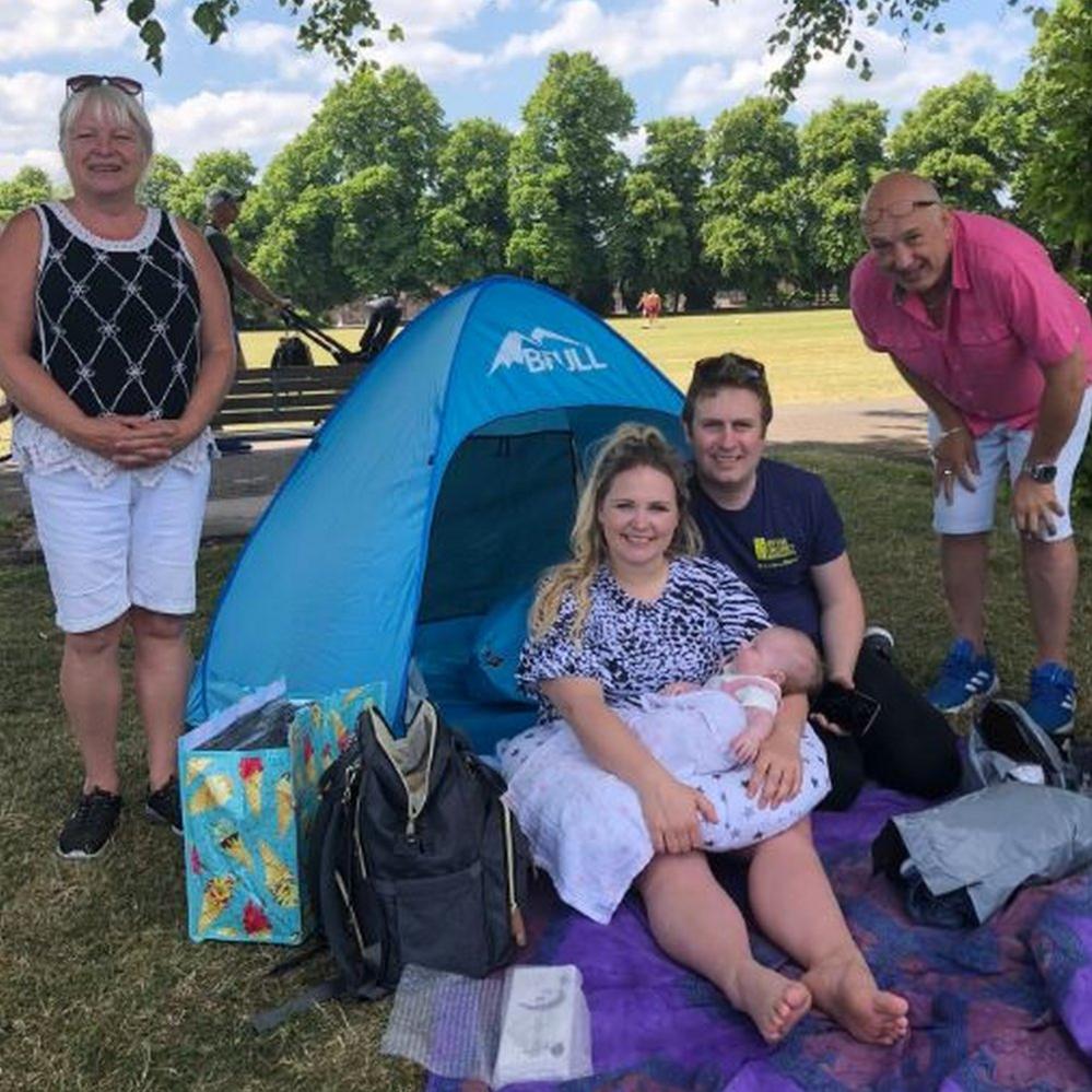 Grandparents meet their new grandchild