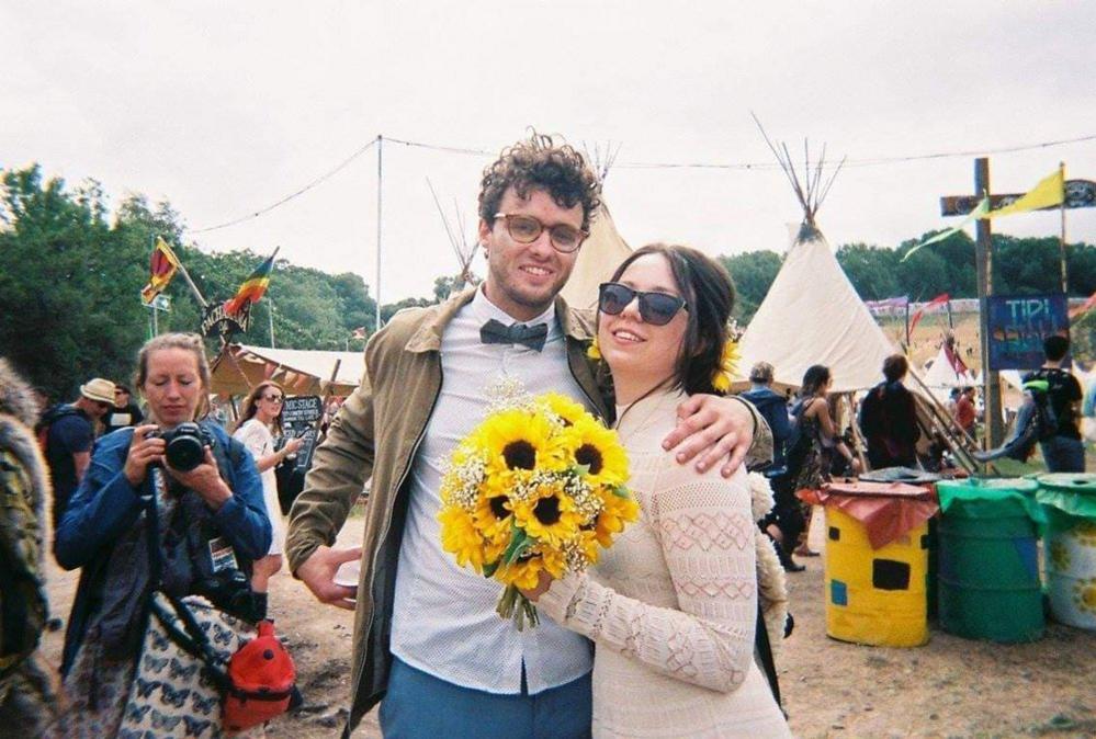 Man with woman holding a bunch of flowers