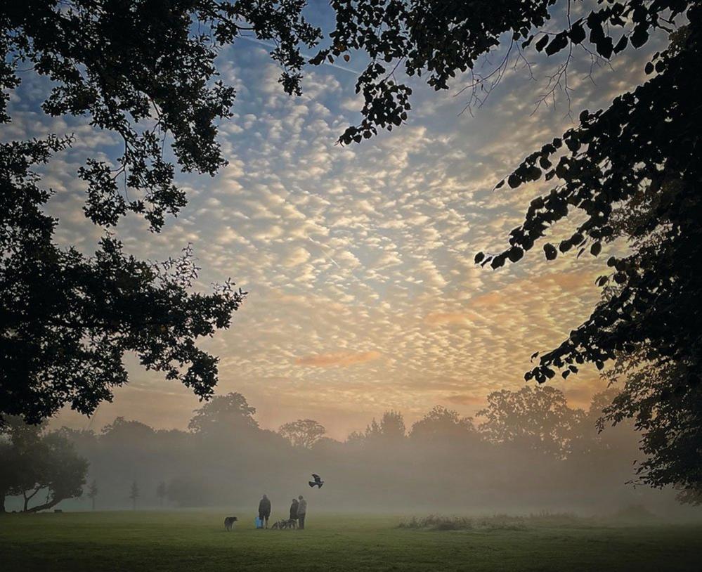 People in Pitshanger Park on a cold October morning