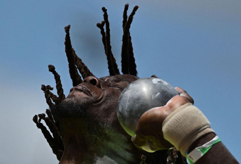 Bahamas' Kendrick Thompson competes in the men's decathlon shot put event at the Alexander Stadium, in Birmingham on day seven of the Commonwealth Games in Birmingham, 4 August 2022.