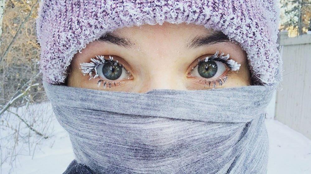 Woman with frozen eyelashes