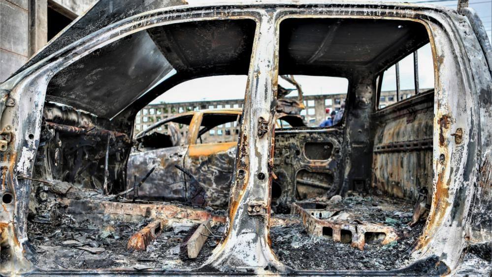 Burnt cars after violent demonstrations contesting the results of the 9 October general elections, in Maputo, Mozambique, 08 November 2024