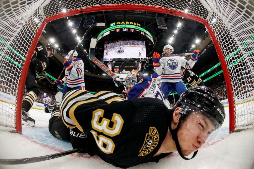 Boston Bruins centre Morgan Geekie ends up in the Edmonton Oilers net