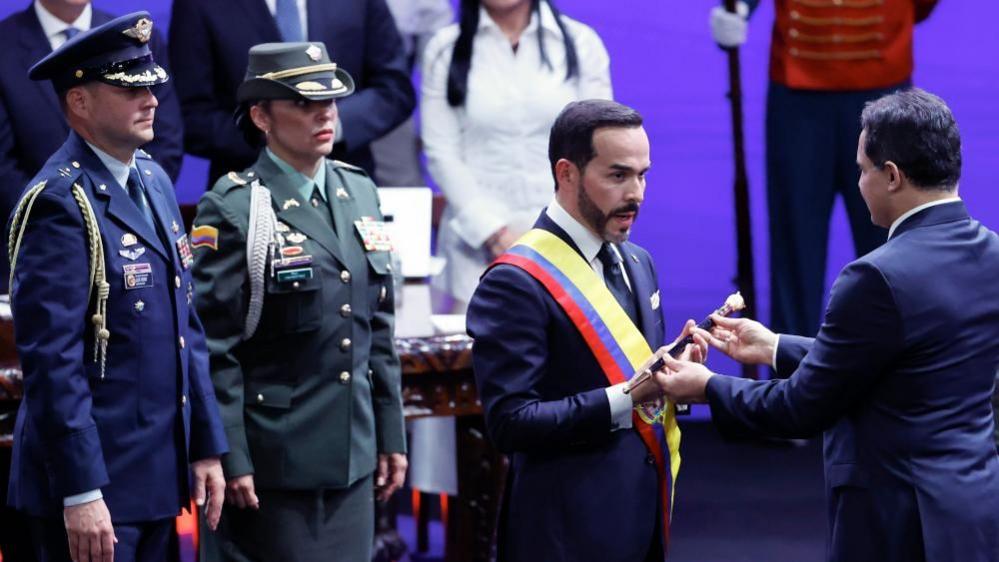 De la Espriella accepts a sceptre during the inauguration ceremony
