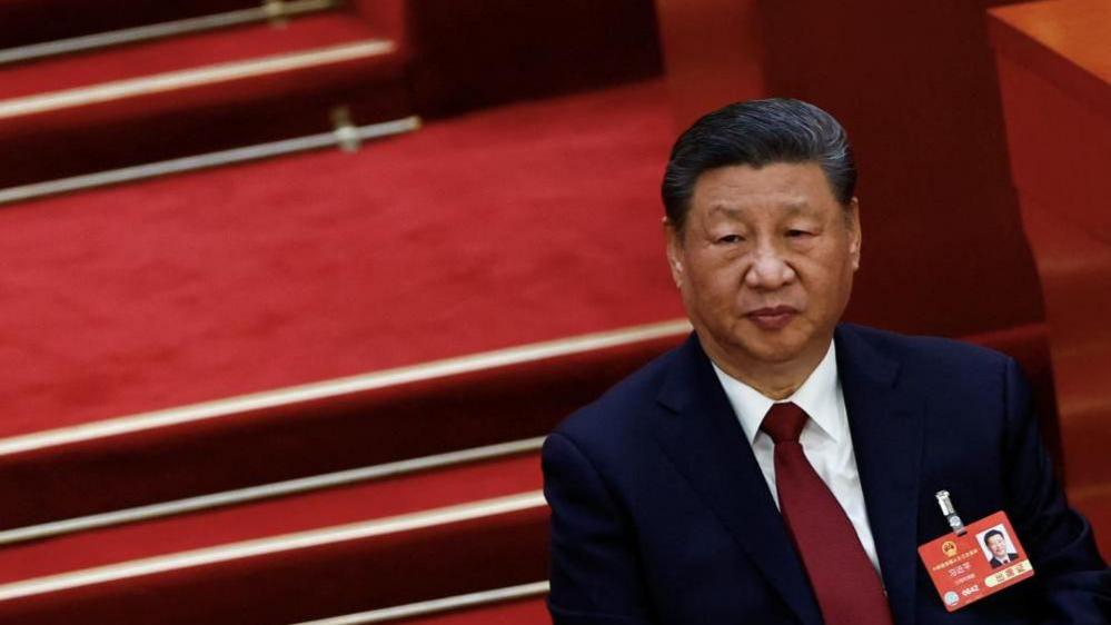 Chinese President Xi Jinping in a suit attends the opening session of the National People's Congress (NPC) at the Great Hall of the People in Beijing, China, March 5, 2025