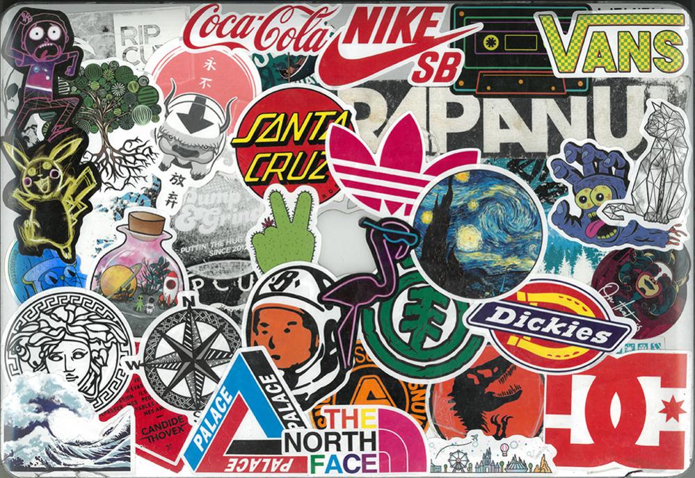 Several logos of brands such as nike, coco cola and vans plastered on a lapton screen