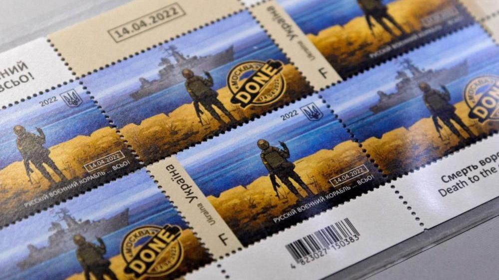 A view of postage stamps showing a Ukrainian soldier raising a middle finger at a Russian warship, with the words "Russian warship - Done!"