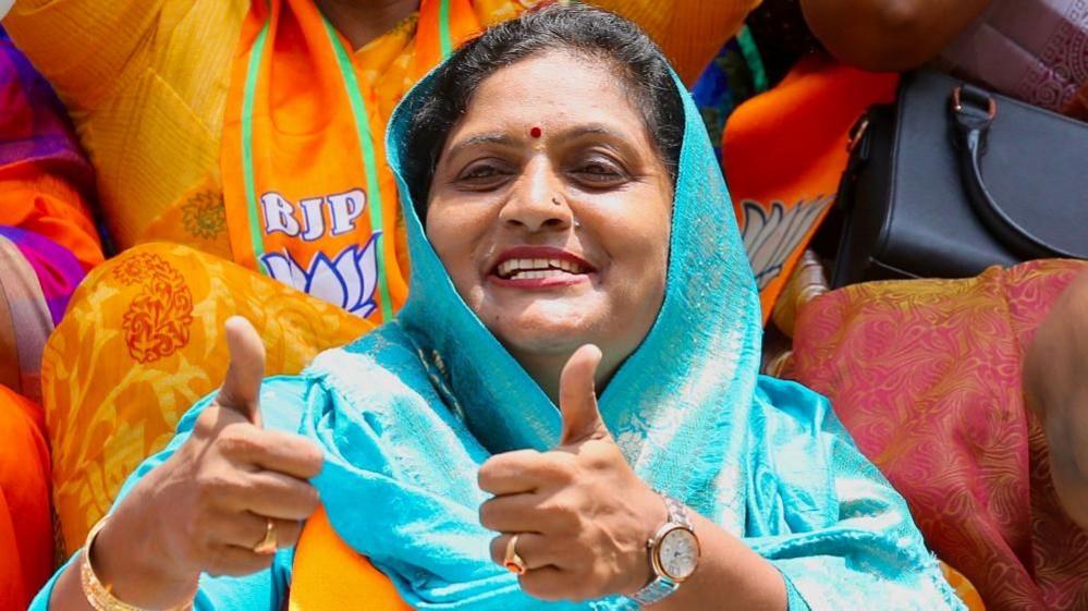 Bharatiya Janata Party (BJP) supporters celebrate as they watch election election results on a television screen at BJP headquarters in Bangalore, India, 04 June 2024. 