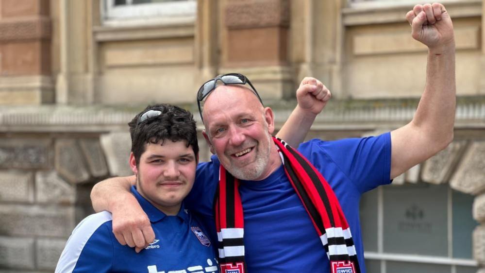 Two men wearing Ipswich shirts 