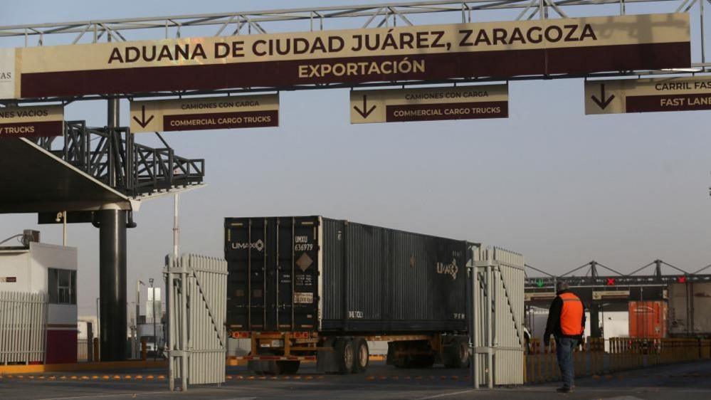 Trucks queue in the export section at the US-Mexico border