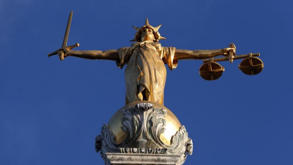 FW Pomeroy's Statue of Justice on top of the Central Criminal Court building, Old Bailey, London. 