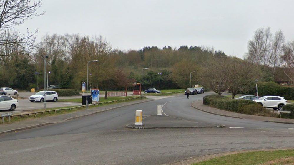 The entrance to a road from a roundabout